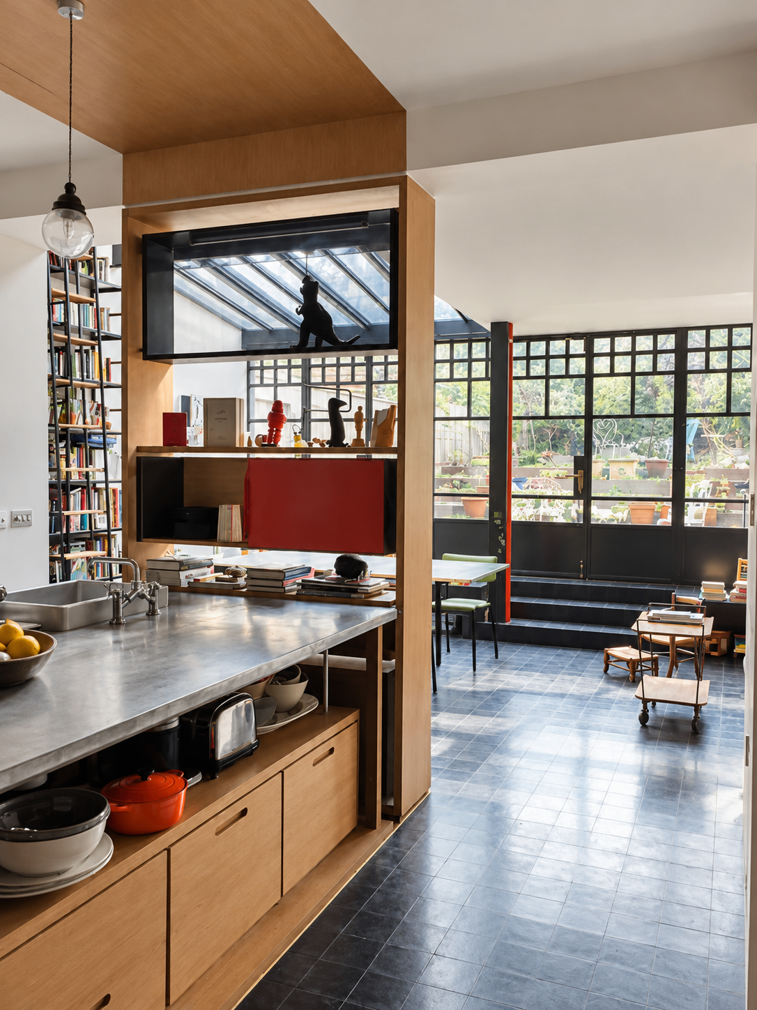 Kitchen with an island and black-framed garden windows